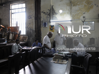 Arshad  Saleem ( R ) addressing a customer issue at The Russell Exchange on Saturday a day prior to the sunday auction on 4th April , 2015 i...