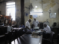 Arshad  Saleem ( R ) addressing a customer issue at The Russell Exchange on Saturday a day prior to the sunday auction on 4th April , 2015 i...