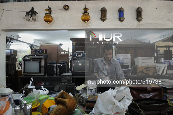 A customer checking items to be auctioned  tomorrow  at The Russell Exchange on Saturday a day prior to the sunday auction on 4th April , 20...