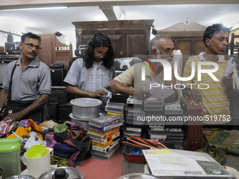 Babloo (Guy with long hair) and Mr. Mondol ( Guy on the left of Babloo) watch closely the items to auctioned during the Auction at The Russe...