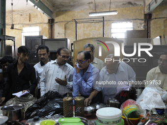 Customers seeing and debating on items put up for auction during the Auction at The Russell Exchange on 5th April , 2015 in Kolkata, India....