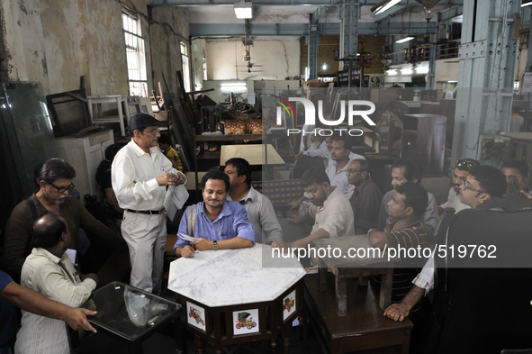 Md. Omar (guy with the black cap) conducting a furniture auction during the Auction at The Russell Exchange on 5th April , 2015 in Kolkata,...