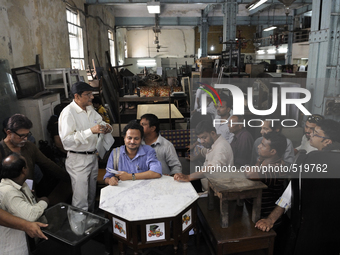 Md. Omar (guy with the black cap) conducting a furniture auction during the Auction at The Russell Exchange on 5th April , 2015 in Kolkata,...