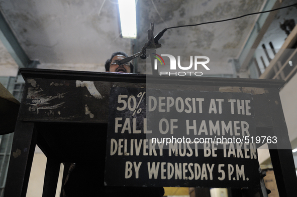 Sheikh Samsuddinan- The Auctioneer sitting on the high chair during the Auction at The Russell Exchange on 5th April , 2015 in Kolkata, Indi...