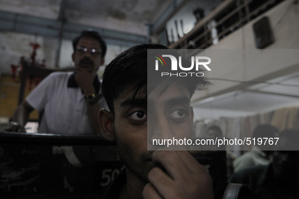 Md Omar(L)-the main auctioneer on that day and Azharuddin(M) both employees of The Russell Exchange watching closely the furniture auction a...