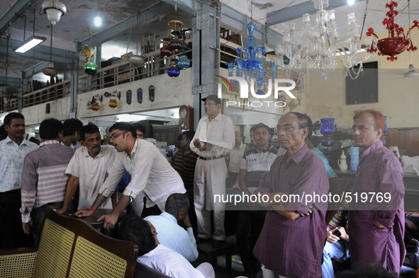 Md. Omar (guy with the black cap) conducting a furniture auction during the Auction at The Russell Exchange on 5th April , 2015 in Kolkata,...