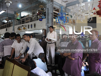 Md. Omar (guy with the black cap) conducting a furniture auction during the Auction at The Russell Exchange on 5th April , 2015 in Kolkata,...