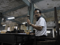 Sheikh Samsuddinan- The Auctioneer knocking his hammer during the Auction at The Russell Exchange on 5th April , 2015 in Kolkata, India. The...