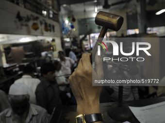 Sheikh Samsuddinan- The Auctioneer knocking his hammer during the Auction at The Russell Exchange on 5th April , 2015 in Kolkata, India. The...