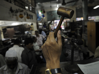 Sheikh Samsuddinan- The Auctioneer knocking his hammer during the Auction at The Russell Exchange on 5th April , 2015 in Kolkata, India. The...