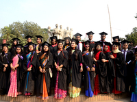 A group of graduates expressing their delight in front of the sculpture Raju at TSC area, on the 52th convocation of the students of Dhaka U...