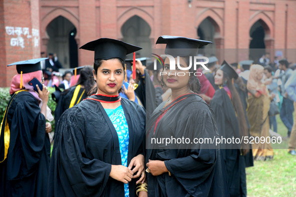 A group of graduates expressing their delight in front of the Curzon hall at university area, on the 52th convocation of the students of Dha...