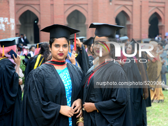 A group of graduates expressing their delight in front of the Curzon hall at university area, on the 52th convocation of the students of Dha...