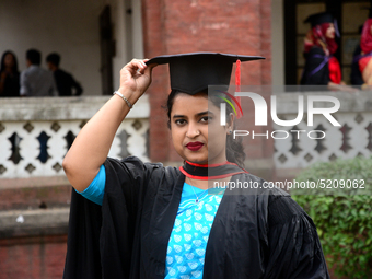 A group of graduates expressing their delight in front of the Curzon hall at university area, on the 52th convocation of the students of Dha...