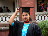 A group of graduates expressing their delight in front of the Curzon hall at university area, on the 52th convocation of the students of Dha...