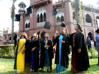 A group of graduates expressing their delight in front of the Curzon hall at university area, on the 52th convocation of the students of Dha...