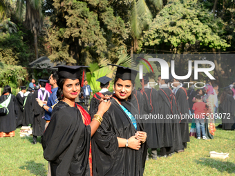 A group of graduates expressing their delight in front of the Curzon hall at university area, on the 52th convocation of the students of Dha...