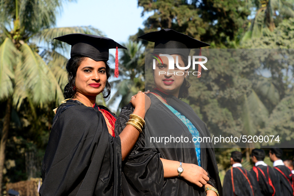 A group of graduates expressing their delight in front of the Curzon hall at university area, on the 52th convocation of the students of Dha...