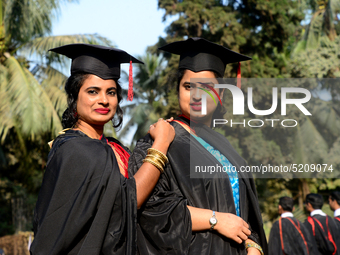 A group of graduates expressing their delight in front of the Curzon hall at university area, on the 52th convocation of the students of Dha...