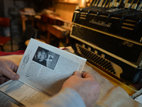 Former theatre actor and long time artist and luthier, Jozef Gmyrek (age 71), shows  a photo of himself when he was an actor.
His work is no...