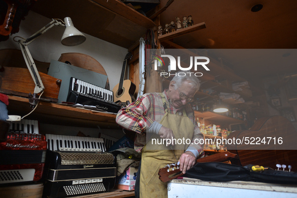 Former theatre actor and long time artist and luthier, Jozef Gmyrek (age 71), repairs a guitar in his workshop. 
His work is not a job but a...