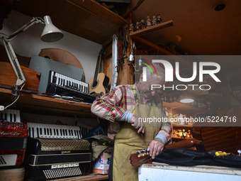 Former theatre actor and long time artist and luthier, Jozef Gmyrek (age 71), repairs a guitar in his workshop. 
His work is not a job but a...