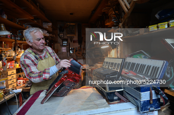 Former theatre actor and long time artist and luthier, Jozef Gmyrek (age 71), repairs an accordion in his workshop.
His work is not a job bu...