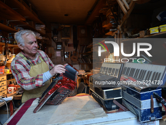 Former theatre actor and long time artist and luthier, Jozef Gmyrek (age 71), repairs an accordion in his workshop.
His work is not a job bu...