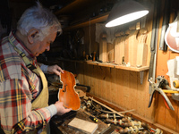 Former theatre actor and long time artist and luthier, Jozef Gmyrek (age 71), repairs a violin in his workshop.  
His work is not a job but...