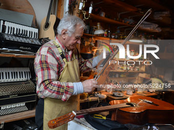 Former theatre actor and long time artist and luthier, Jozef Gmyrek (age 71), tunes a violin in his workshop.
His work is not a job but a pa...