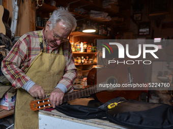 Former theatre actor and long time artist and luthier, Jozef Gmyrek (age 71), repairs a guitar in his workshop.
His work is not a job but a...