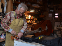 Former theatre actor and long time artist and luthier, Jozef Gmyrek (age 71), repairs a guitar in his workshop.
His work is not a job but a...