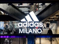 Employees of the well-known clothing brand Adidas protest in front of the Adidas store in Milan against the 41 dismissals due to the relocat...