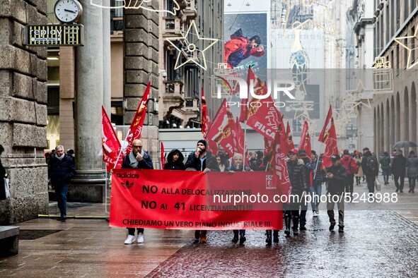 Employees of the well-known clothing brand Adidas protest in front of the Adidas store in Milan against the 41 dismissals due to the relocat...