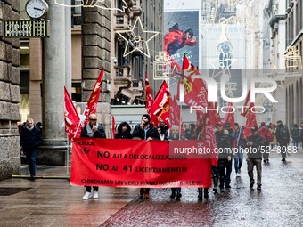 Employees of the well-known clothing brand Adidas protest in front of the Adidas store in Milan against the 41 dismissals due to the relocat...