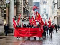 Employees of the well-known clothing brand Adidas protest in front of the Adidas store in Milan against the 41 dismissals due to the relocat...