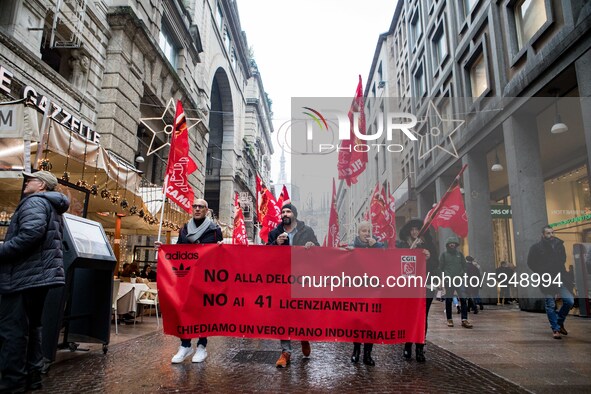 Employees of the well-known clothing brand Adidas protest in front of the Adidas store in Milan against the 41 dismissals due to the relocat...