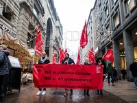 Employees of the well-known clothing brand Adidas protest in front of the Adidas store in Milan against the 41 dismissals due to the relocat...