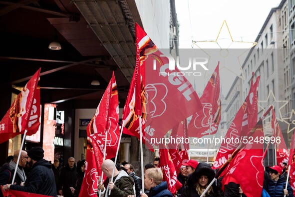 Employees of the well-known clothing brand Adidas protest in front of the Adidas store in Milan against the 41 dismissals due to the relocat...