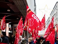 Employees of the well-known clothing brand Adidas protest in front of the Adidas store in Milan against the 41 dismissals due to the relocat...