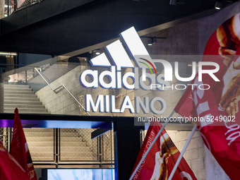 Employees of the well-known clothing brand Adidas protest in front of the Adidas store in Milan against the 41 dismissals due to the relocat...