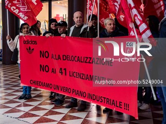 Employees of the well-known clothing brand Adidas protest in front of the Adidas store in Milan against the 41 dismissals due to the relocat...