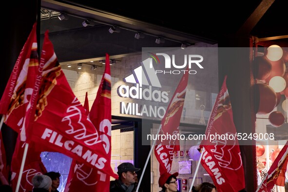 Employees of the well-known clothing brand Adidas protest in front of the Adidas store in Milan against the 41 dismissals due to the relocat...