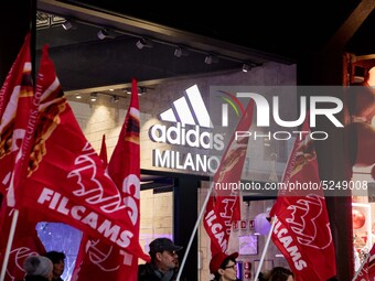 Employees of the well-known clothing brand Adidas protest in front of the Adidas store in Milan against the 41 dismissals due to the relocat...