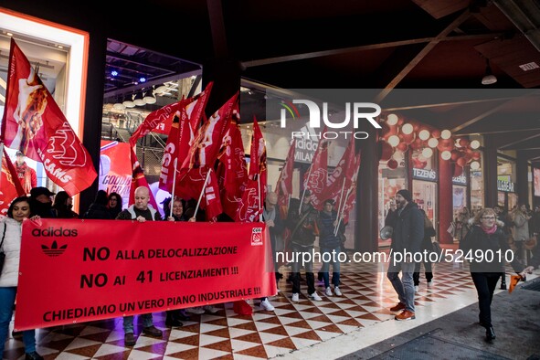 Employees of the well-known clothing brand Adidas protest in front of the Adidas store in Milan against the 41 dismissals due to the relocat...