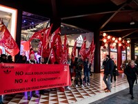 Employees of the well-known clothing brand Adidas protest in front of the Adidas store in Milan against the 41 dismissals due to the relocat...