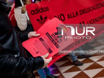 Employees of the well-known clothing brand Adidas protest in front of the Adidas store in Milan against the 41 dismissals due to the relocat...