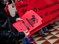 Employees of the well-known clothing brand Adidas protest in front of the Adidas store in Milan against the 41 dismissals due to the relocat...