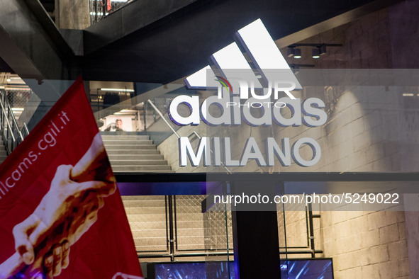 Employees of the well-known clothing brand Adidas protest in front of the Adidas store in Milan against the 41 dismissals due to the relocat...