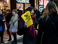 Employees of the well-known clothing brand Adidas protest in front of the Adidas store in Milan against the 41 dismissals due to the relocat...